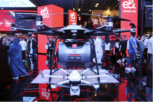A CALIFORNIA GROUND SQUIRREL IN CONTA COSTA COUNTY RUNS WITH A VOLE IT HUNTED IN ITS MOUTH.